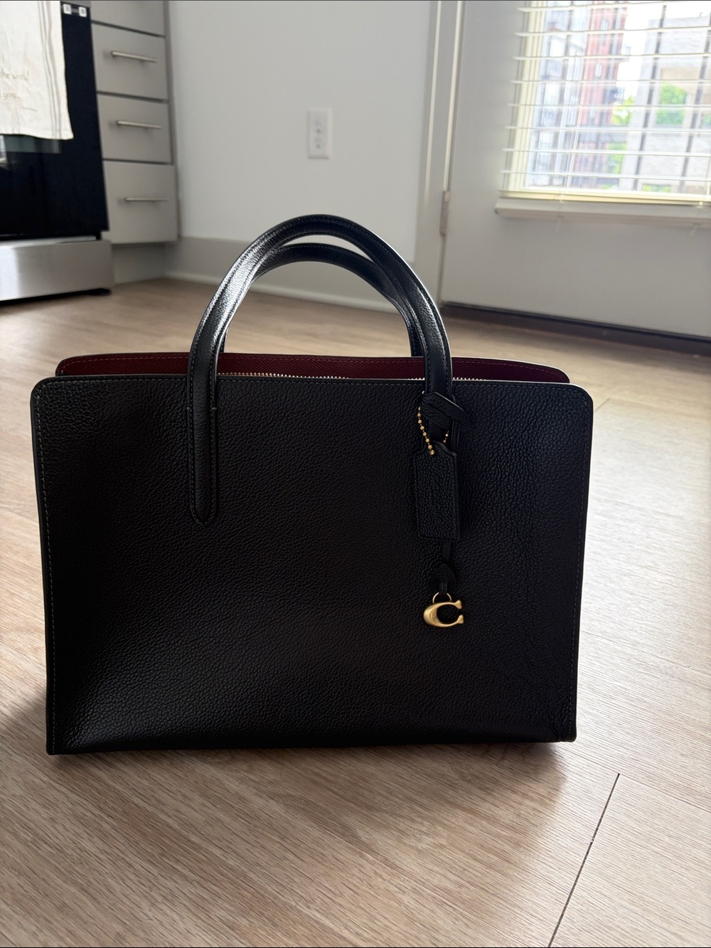 Black Leather Tote with Burgundy Interior and Gold Accent